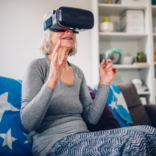 73_9282_07Dec2022130515_Senior Woman Wearing a VR Headset 540px.jpg